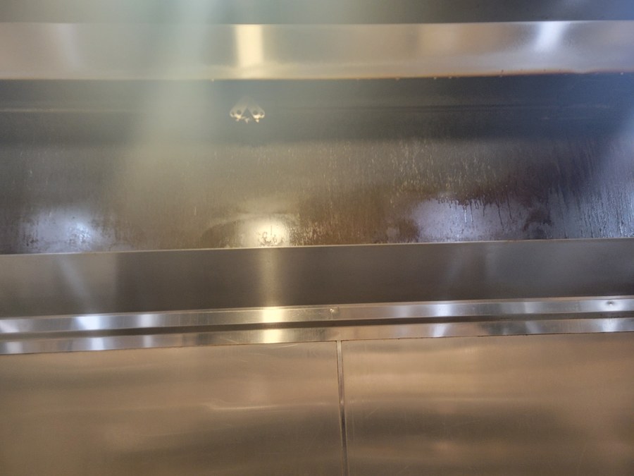 Commercial hood plenum before cleaning